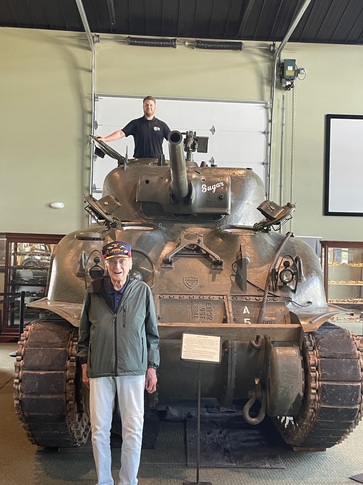 A visitor beside our M4A1 Sherman Grizzly tank