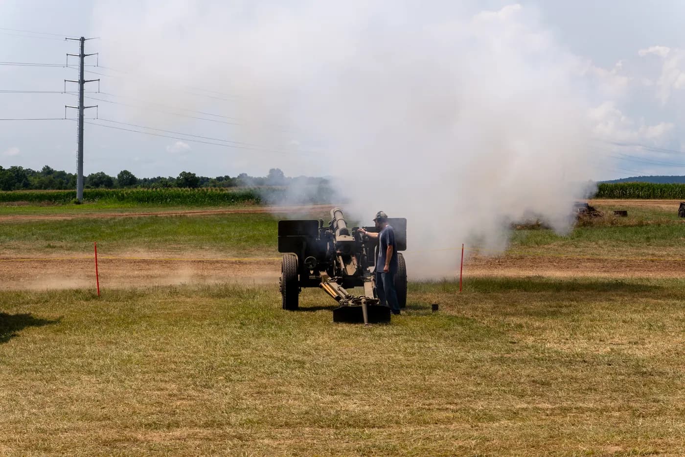 An artillery piece fires during a demonstration