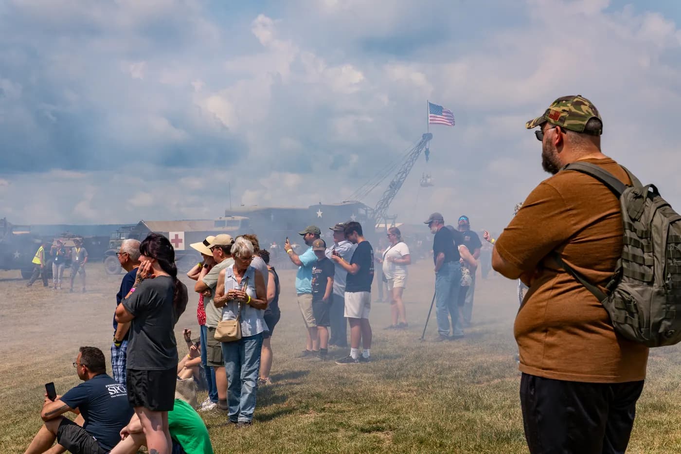 Visitors watch an artillery demonstration