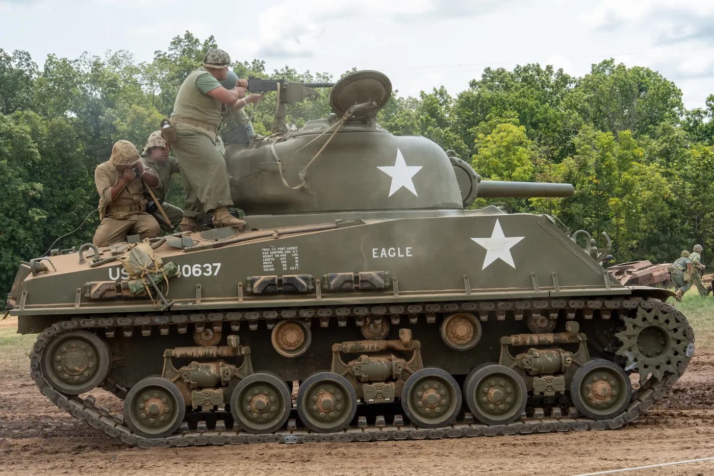 A Sherman tank and its crew on the demonstration field